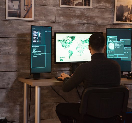 Back View Of Young Hacker Sitting On Desk Writing 2021 08 27 18 39 43 Utc